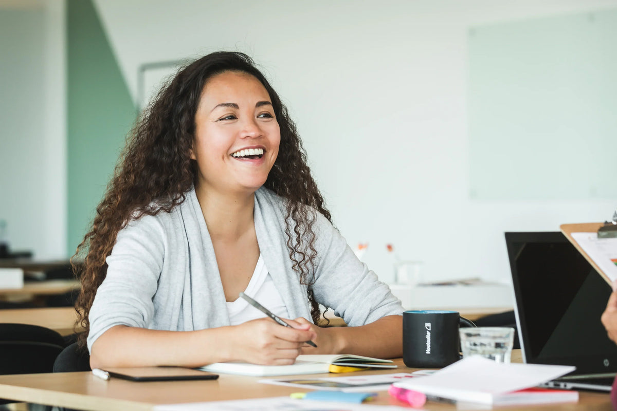 happy-woman-at-work - ClinAdvize